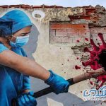 مبارزه پرستار با کرونا بر روی دیوار + عکس
